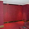 Studded fabric covered door panels in Cinema Room